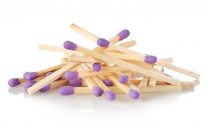 Purple matches isolated on a white background